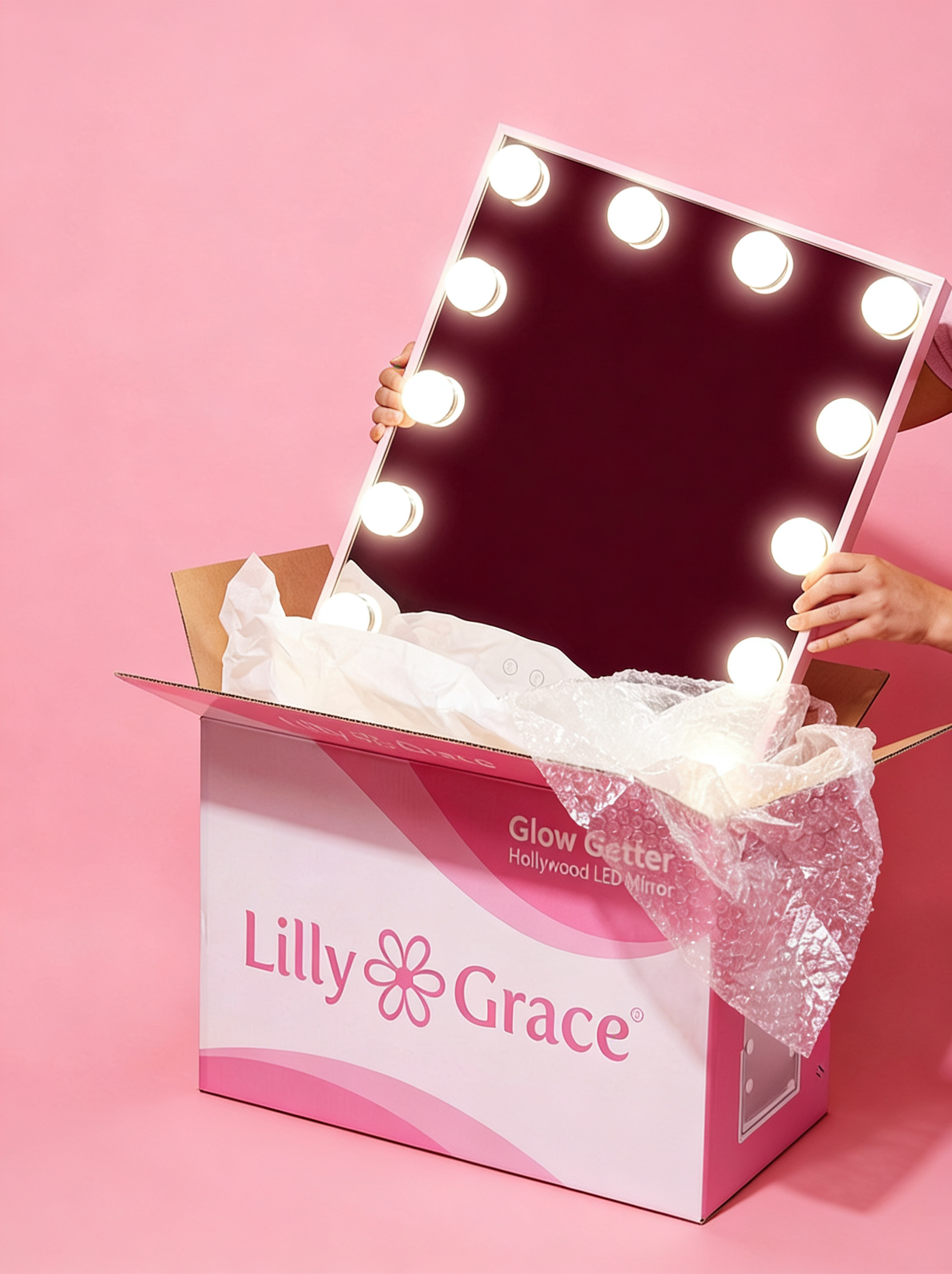 Lilly Grace Glow Getter Hollywood LED mirror being unboxed from pink shipping box